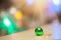 bokeh light and a green ball ornament 
