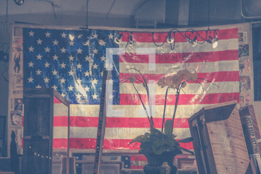 large American flag hanging in a studio