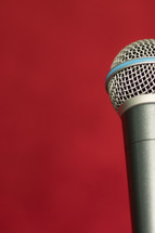 microphone against a red background 