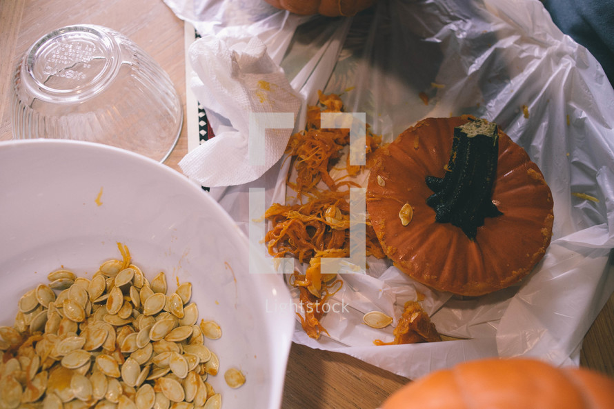 taking seeds out of a pumpkin 