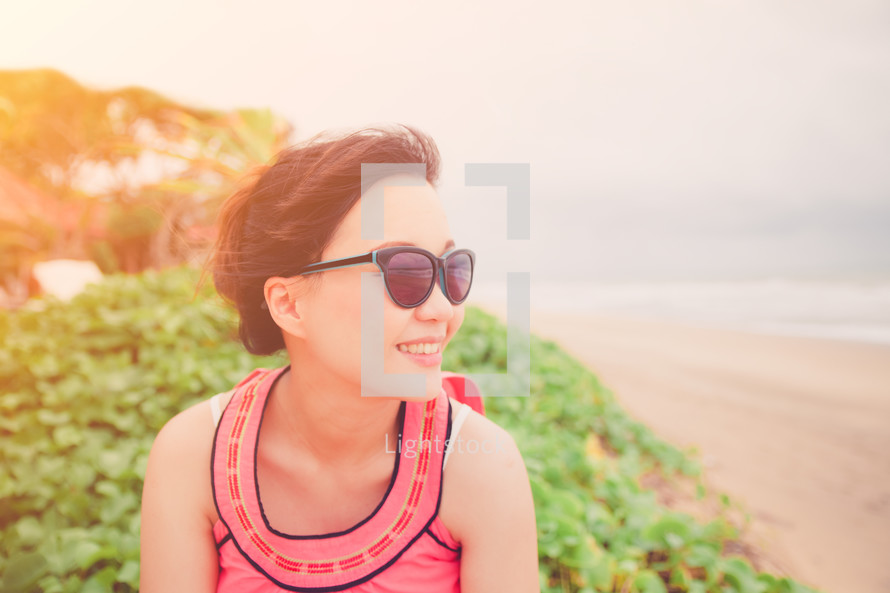 woman in sunglasses on a beach 