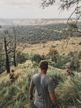 men hiking a mountain landscape 