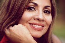 A smiling hispanic woman