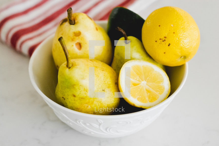 pears and lemons in a bowl 