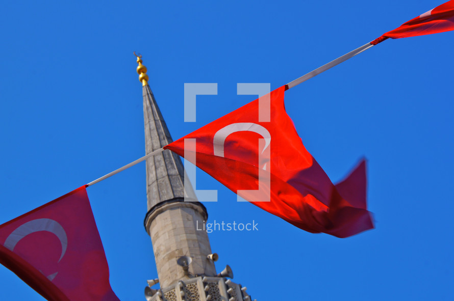 Turkish flags hanging near a mosque