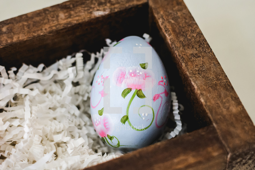 porcelain Easter egg in a wood box 