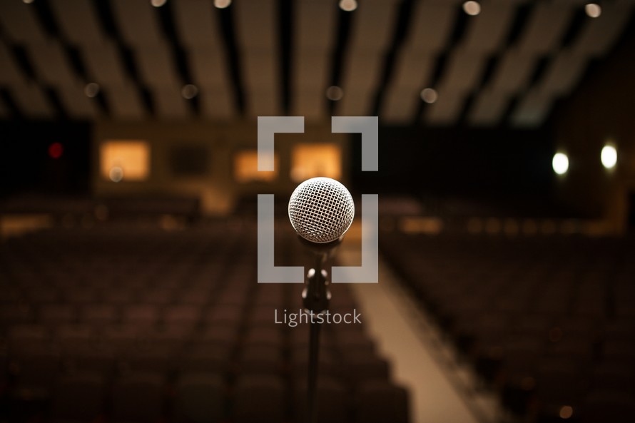 Microphone on stage in an empty auditorium