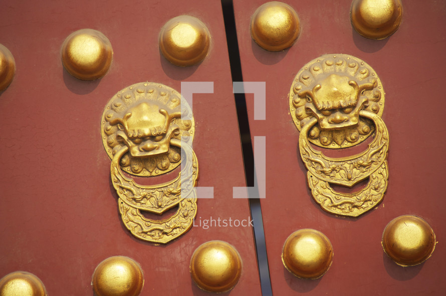 Forbidden Palace main gate doors with dragon handles and brass studs