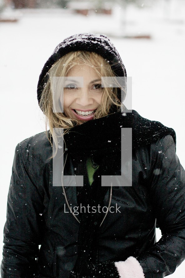 A woman smiling in the snow