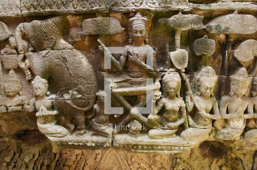 Carved stone wall relief depicting Hindu Gods