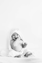 an infant in a towel 