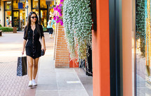 Woman in black dress shopping