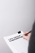 A Man Signing Up To Be in a Life Group