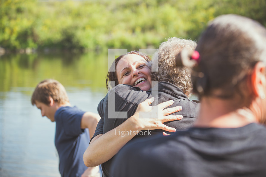 hugs after a baptism 