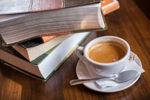 stack of books and a cup of tea