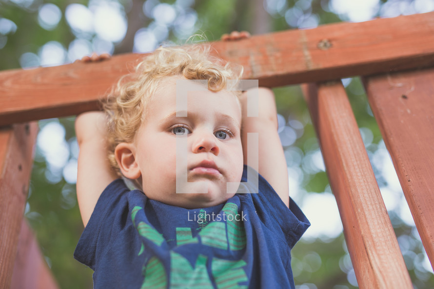 face of a toddler boy on a playground 