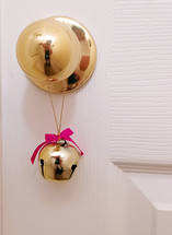 Christmas bell hanging on door knob