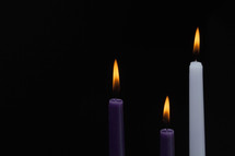advent candles on a black background 