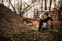 a child playing outdoors in fall 