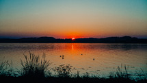 sunset behind a lake 