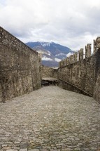 cobblestone path and castle walls 