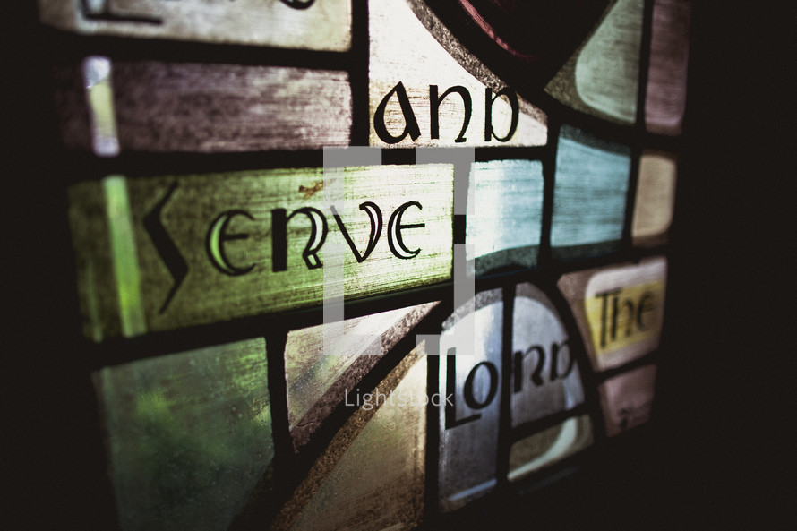 Stained window glass - go and serve the Lord
