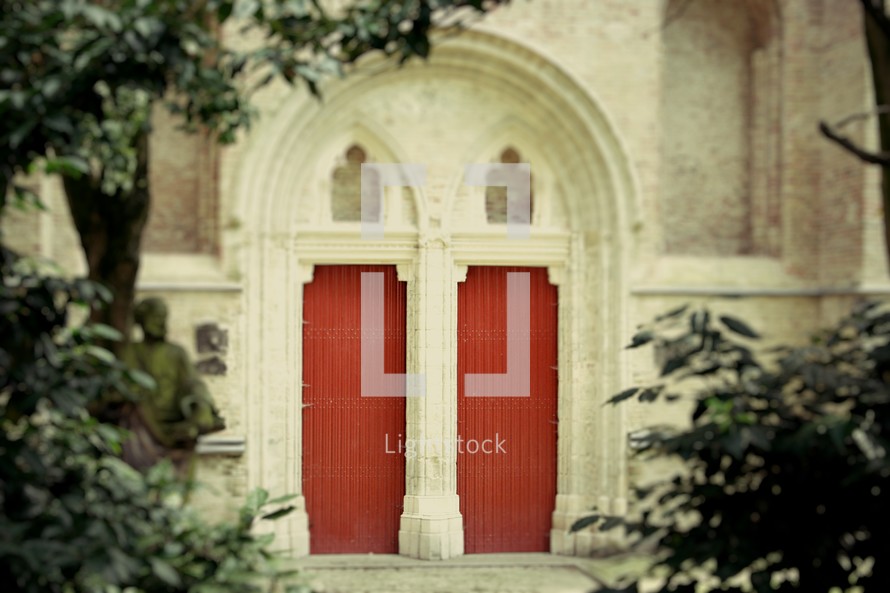red doors on a church