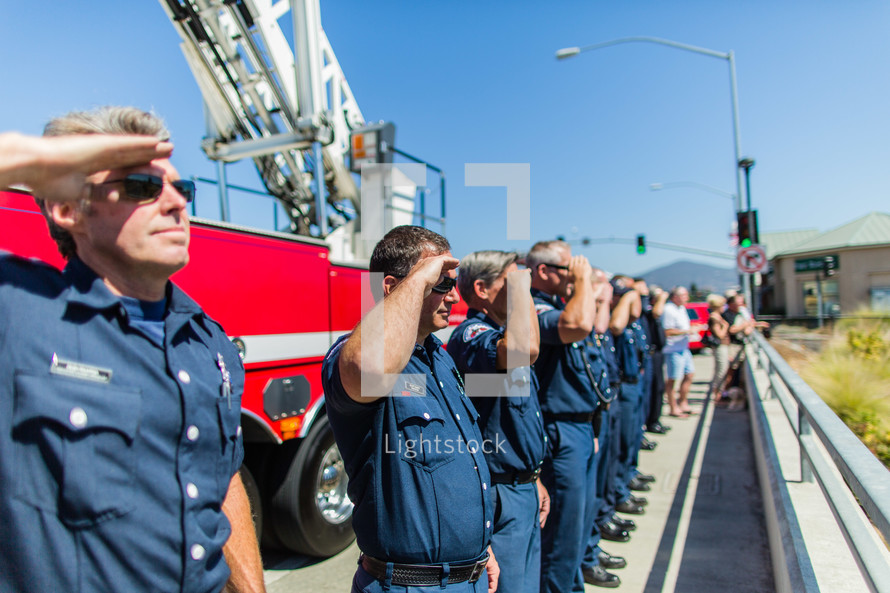 fire fighters men in salute honor respect first responders hero 
