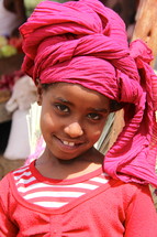 Young Ethiopian girl wearing a traditional head scarf 