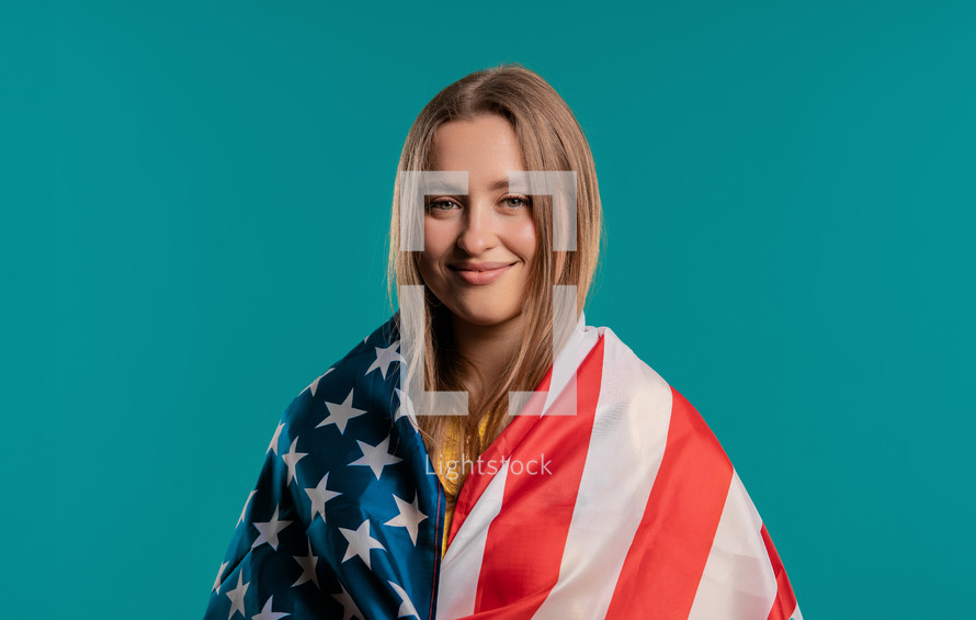 Happy woman with national USA flag on yellow background. American patriot, 4th of July - Independence day celebration, election, America, labor. US banner. High quality photo