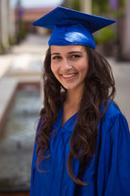a teen girl in a cap and gown 