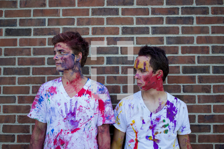 teen boys covered in paint 