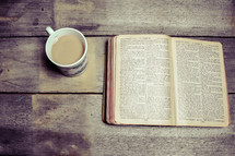 coffee mug and opened Bible 