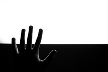 raised hand and black and white background 