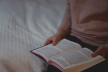 a person reading a Bible 