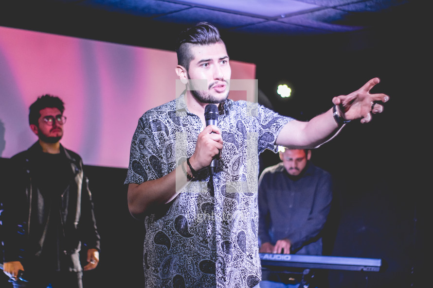 worship leader holding a microphone 