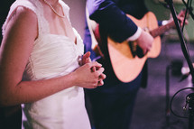A bride and groom singing. 
