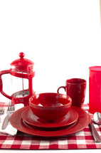 Red dishware on white background