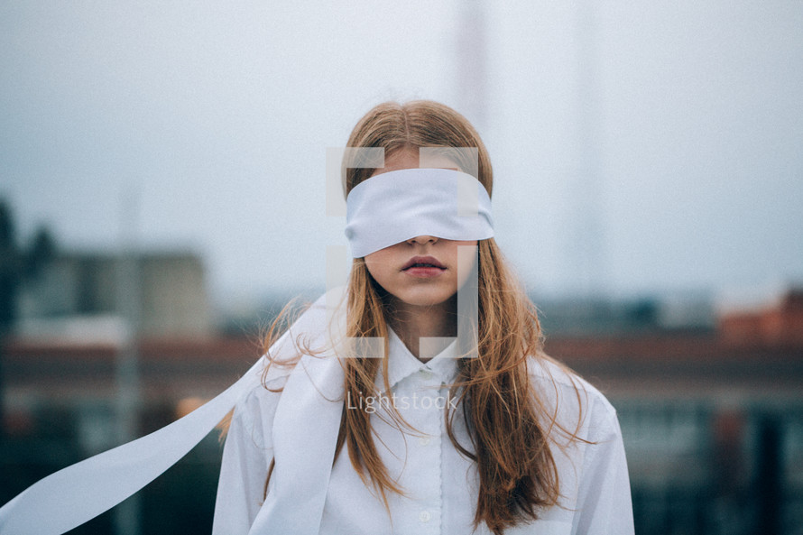 a blindfolded woman 