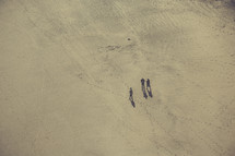 men walking through a desert 