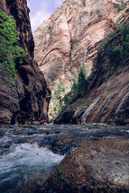flowing river at the bottom of a canyon 