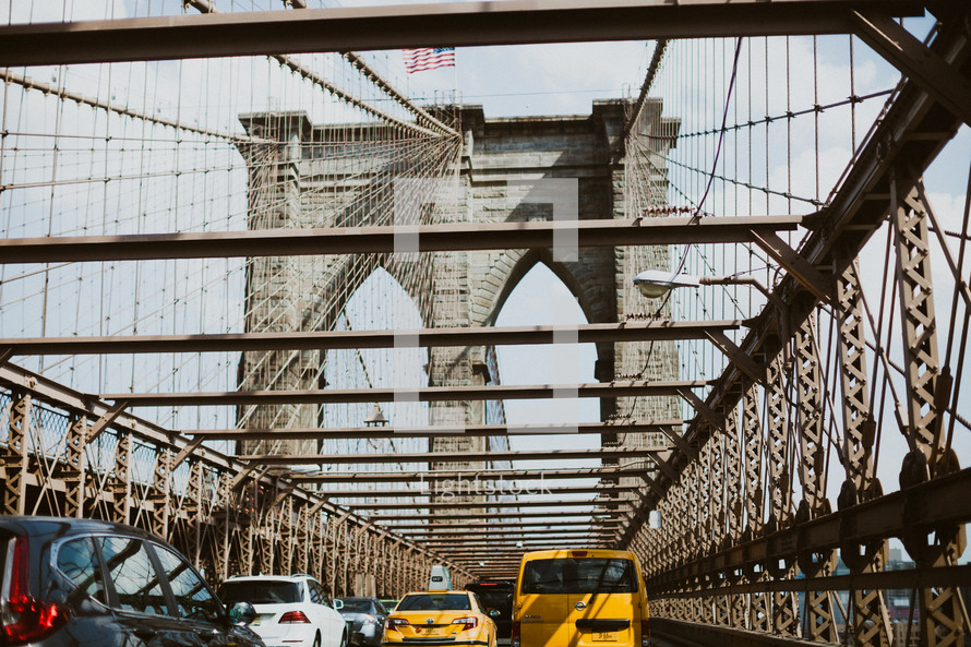 cabs crossing the Brooklyn Bridge 