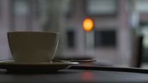coffee mug and spoon in a window 
