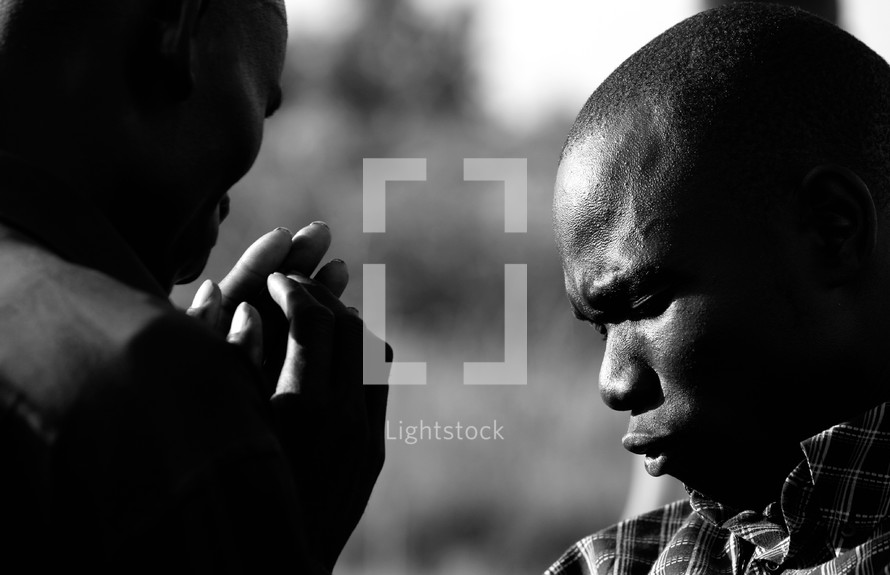 Men in fervent prayer