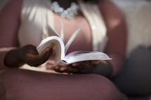 African American woman reading a Bible at a Bible study 