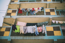 clothes hanging on a clothes line and balcony 