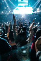 raised hands during worship music in a stadium 