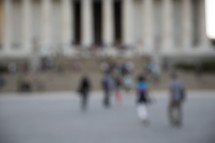 blurry image of people in a crowd 