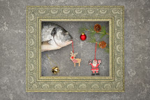 Fish with Christmas decor in a frame