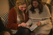 Two women reading the Bible together.